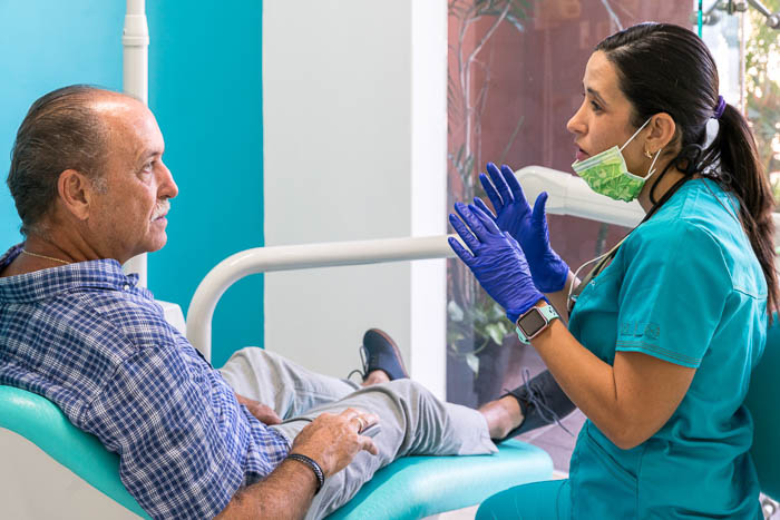 The doctor is explaining the 4 on 1 procedure to a patient in Mexico.