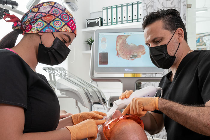 Dentist implementing all on 6 procedure on patient