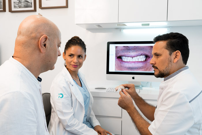 Dentist showing teeth after successful bone graft